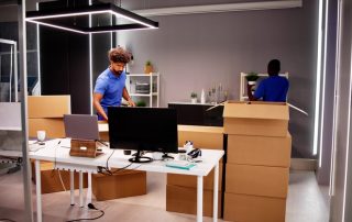 Professional,Movers,Packing,Boxes,In,Modern,Office